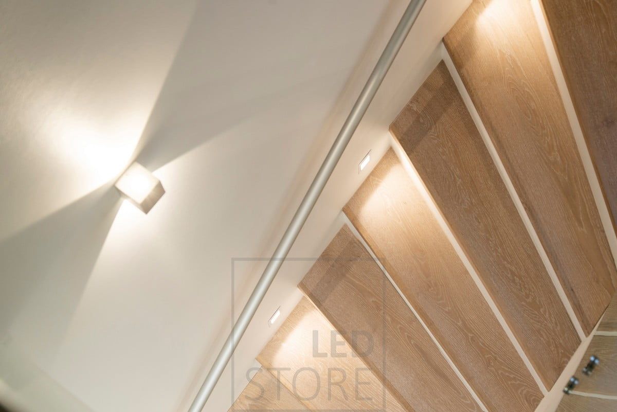 Bi-directional luminaires combined with soft lighting for stair treads.